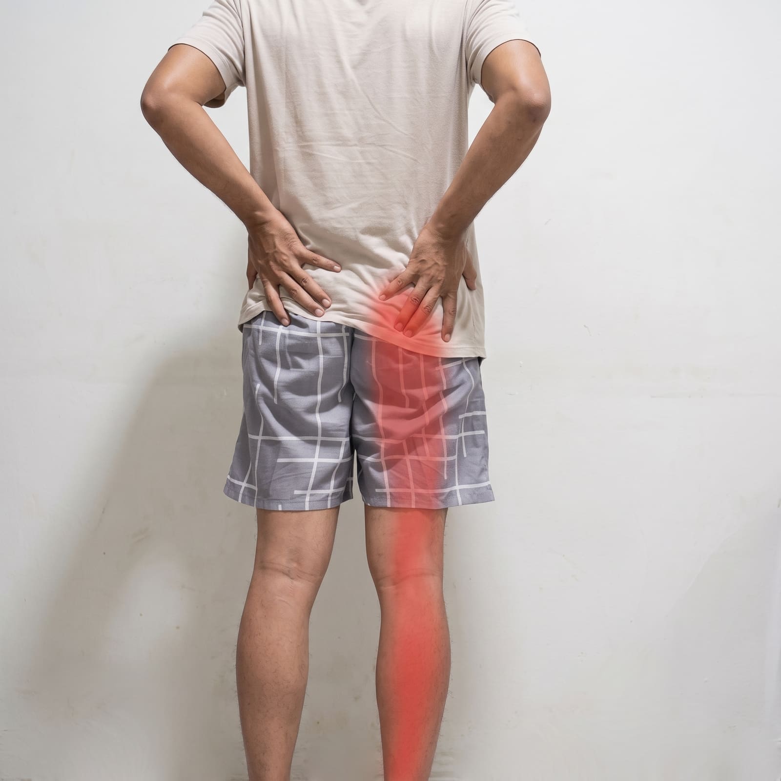 A physiotherapist guiding a movement to ease nerve pain at home